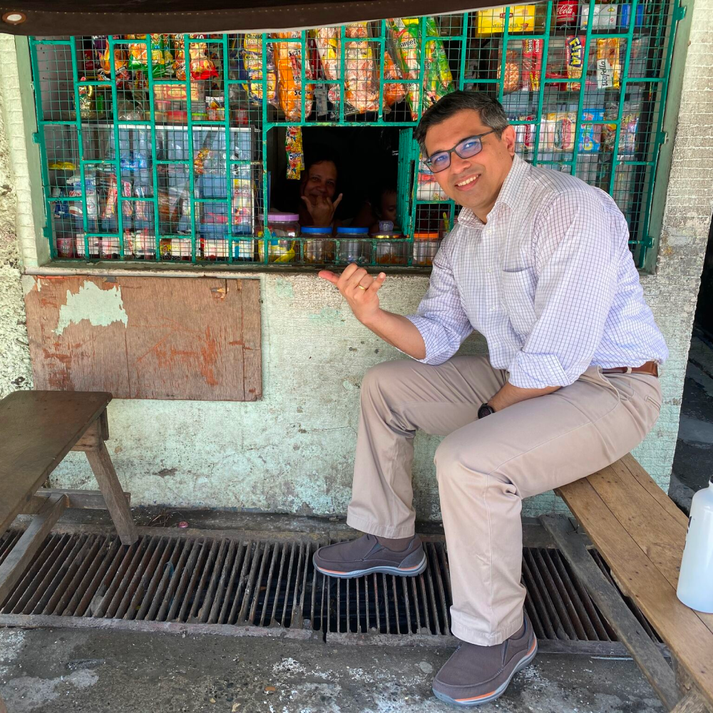 Shubhrendu, Co-Founder & CEO, visiting a yufin user behind the counter of her sari-sari store