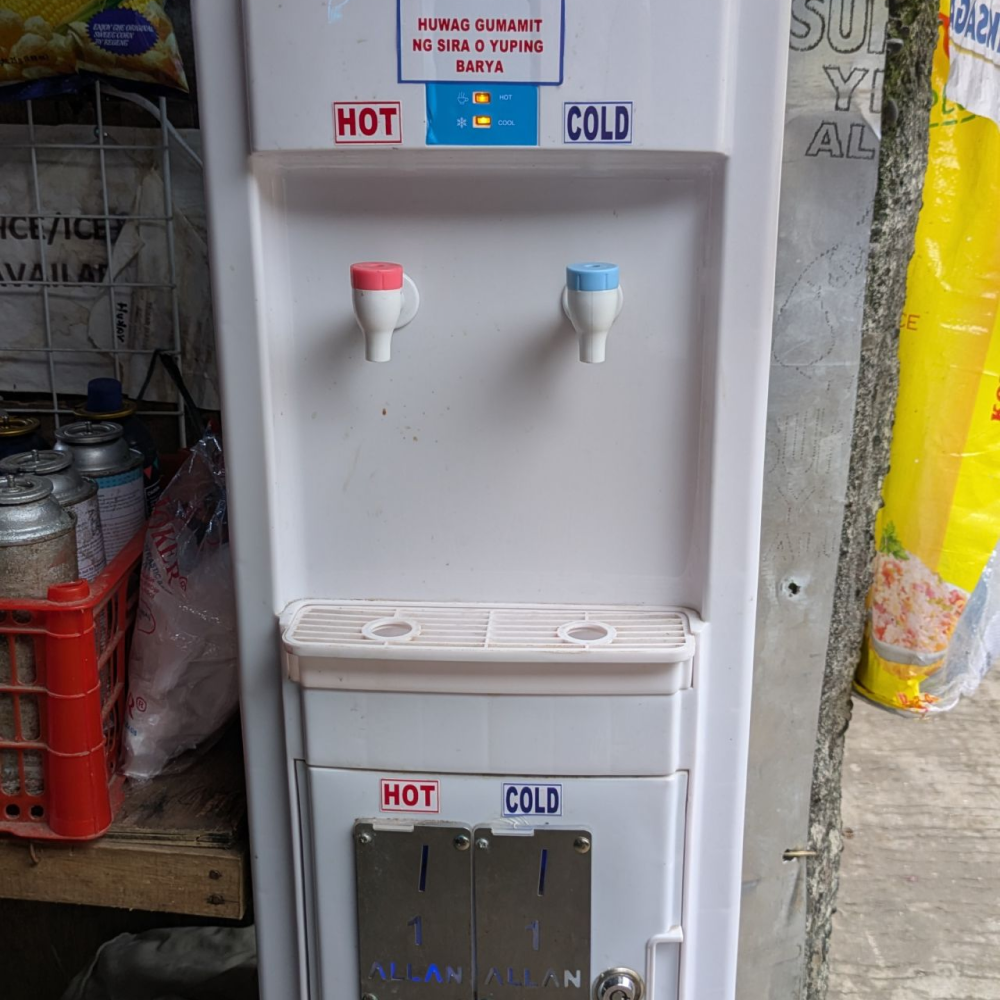 Coin-operated hot and cold water dispenser